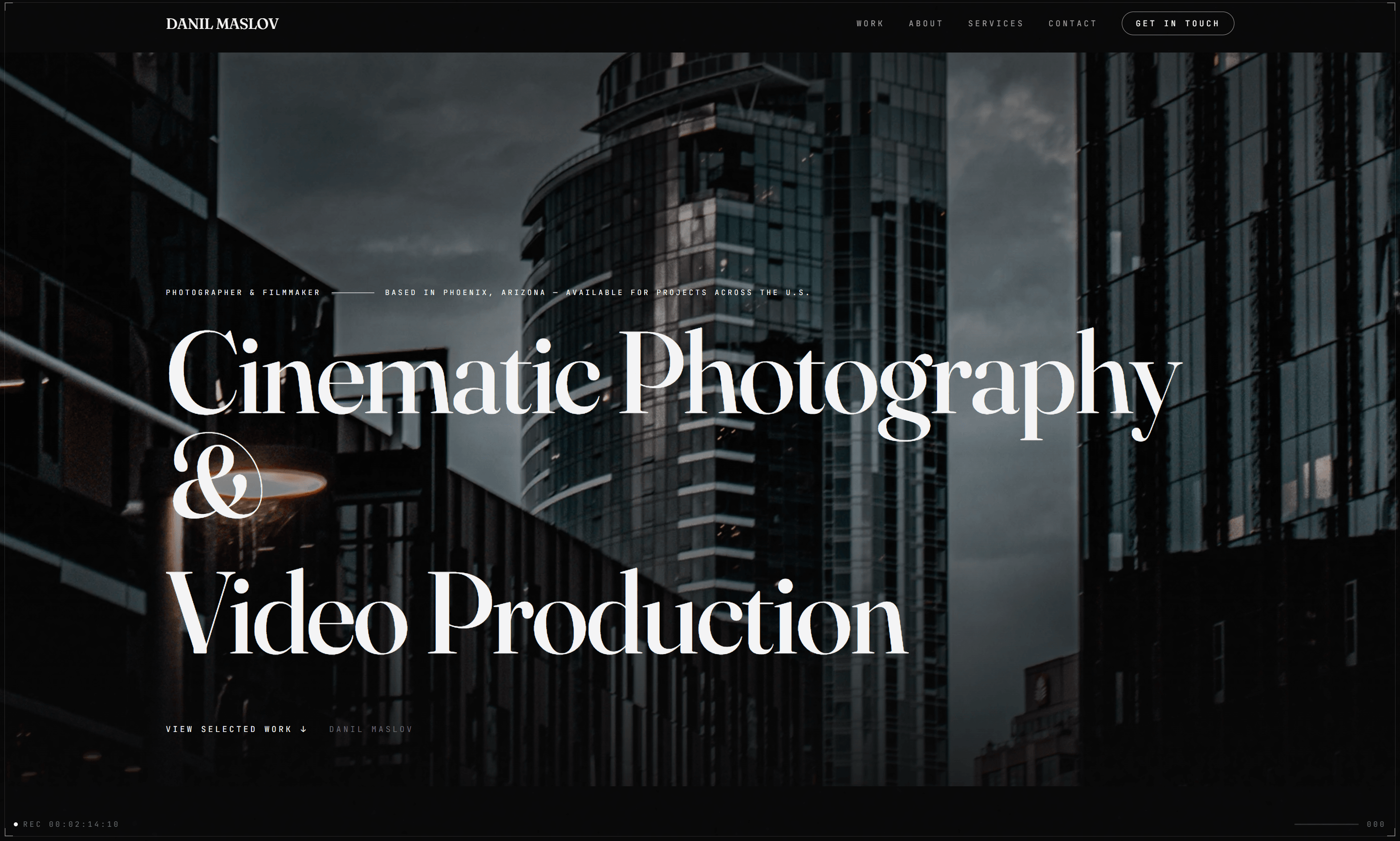 Homepage of danilmaslov.com: Cinematic Photography & Video Production, over a photograph of downtown towers under storm clouds