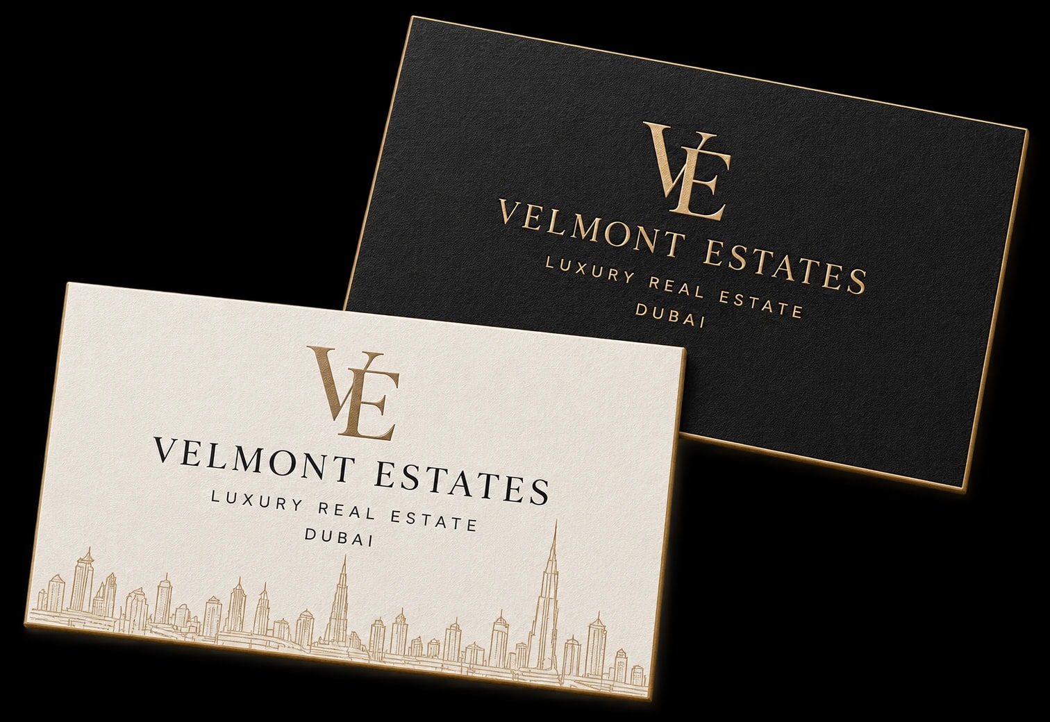 Velmont Estates business cards with brass lettering and a Dubai skyline